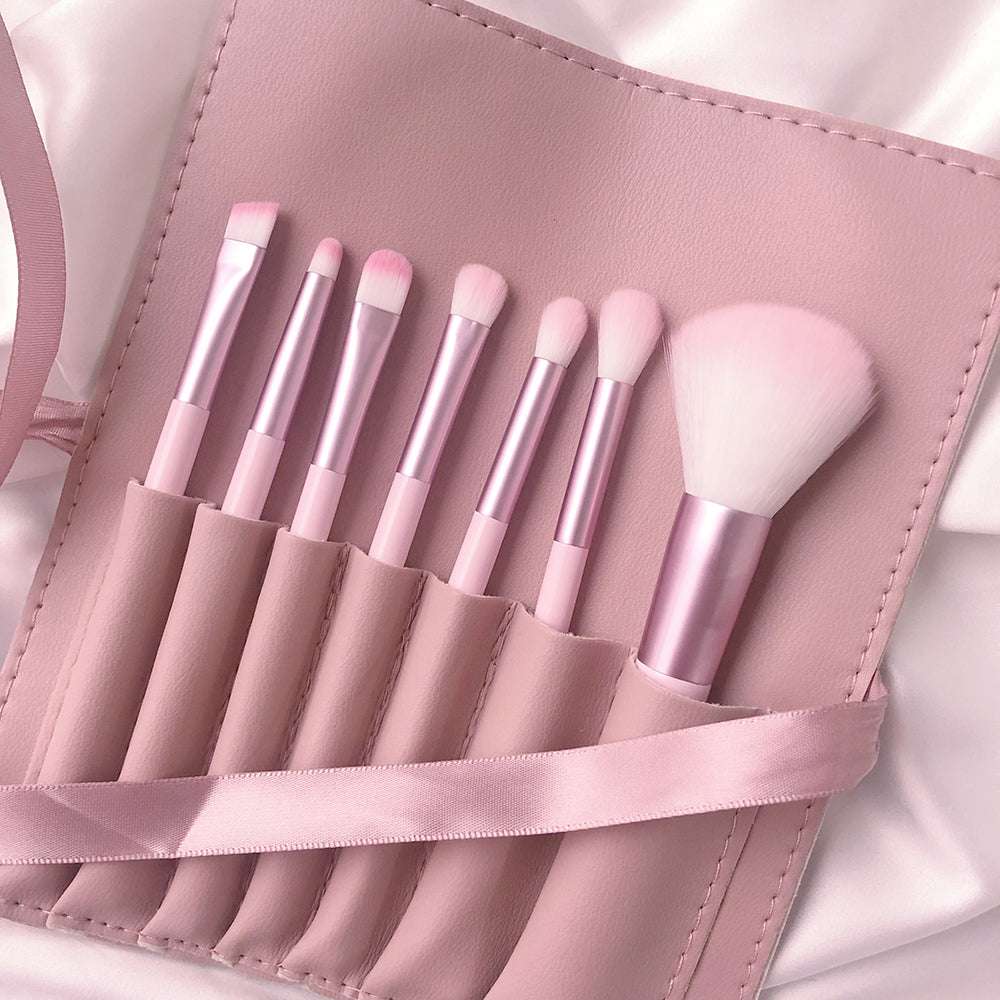 Ultra soft makeup brush set with pink and blue handles and leather pouch