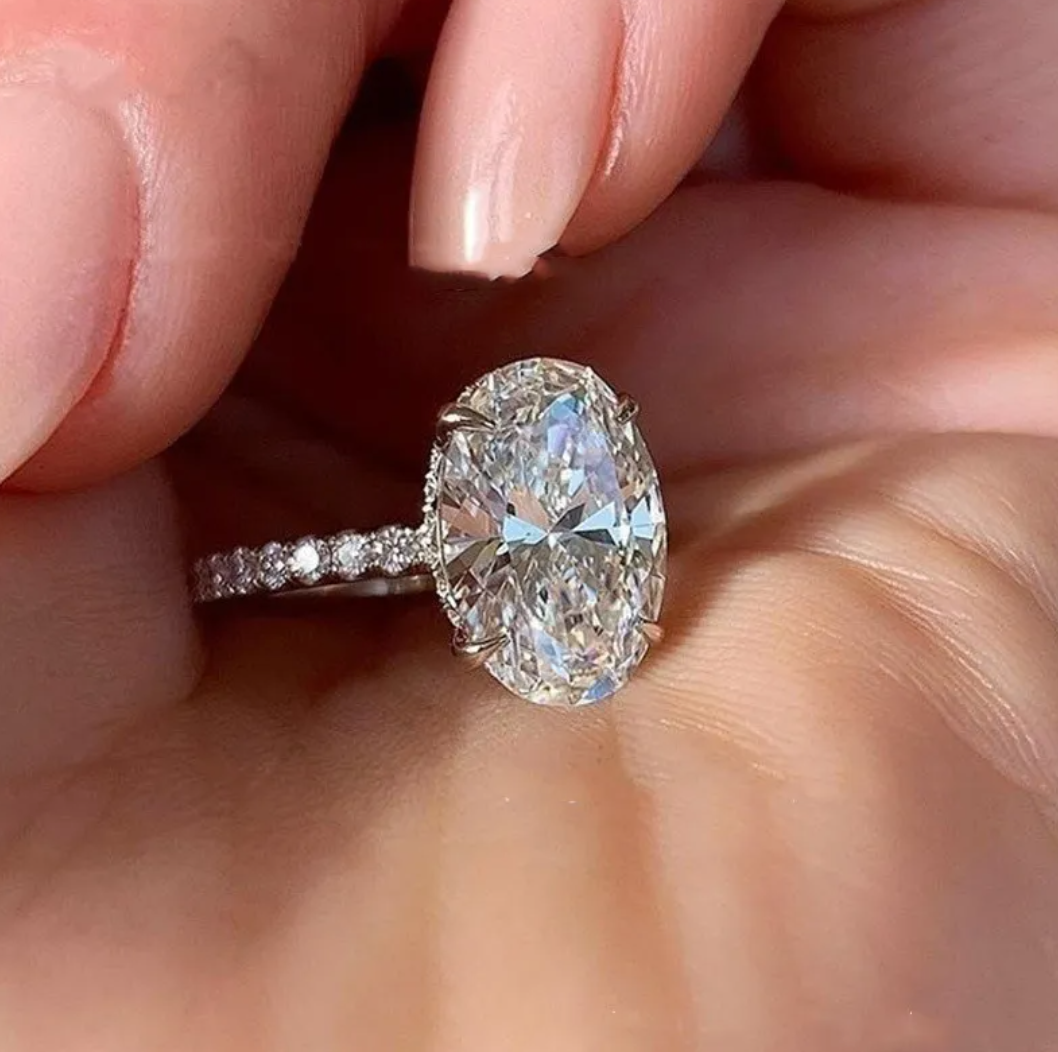 Platinum zircon love ring with sparkling stone on sleek band