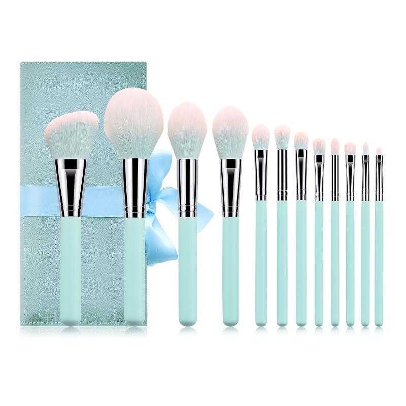 Ultra soft makeup brush set with pink and blue handles and leather bag